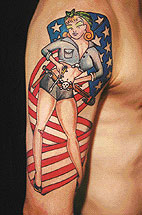 Arm tattoo of woman in front of U.S. Flag