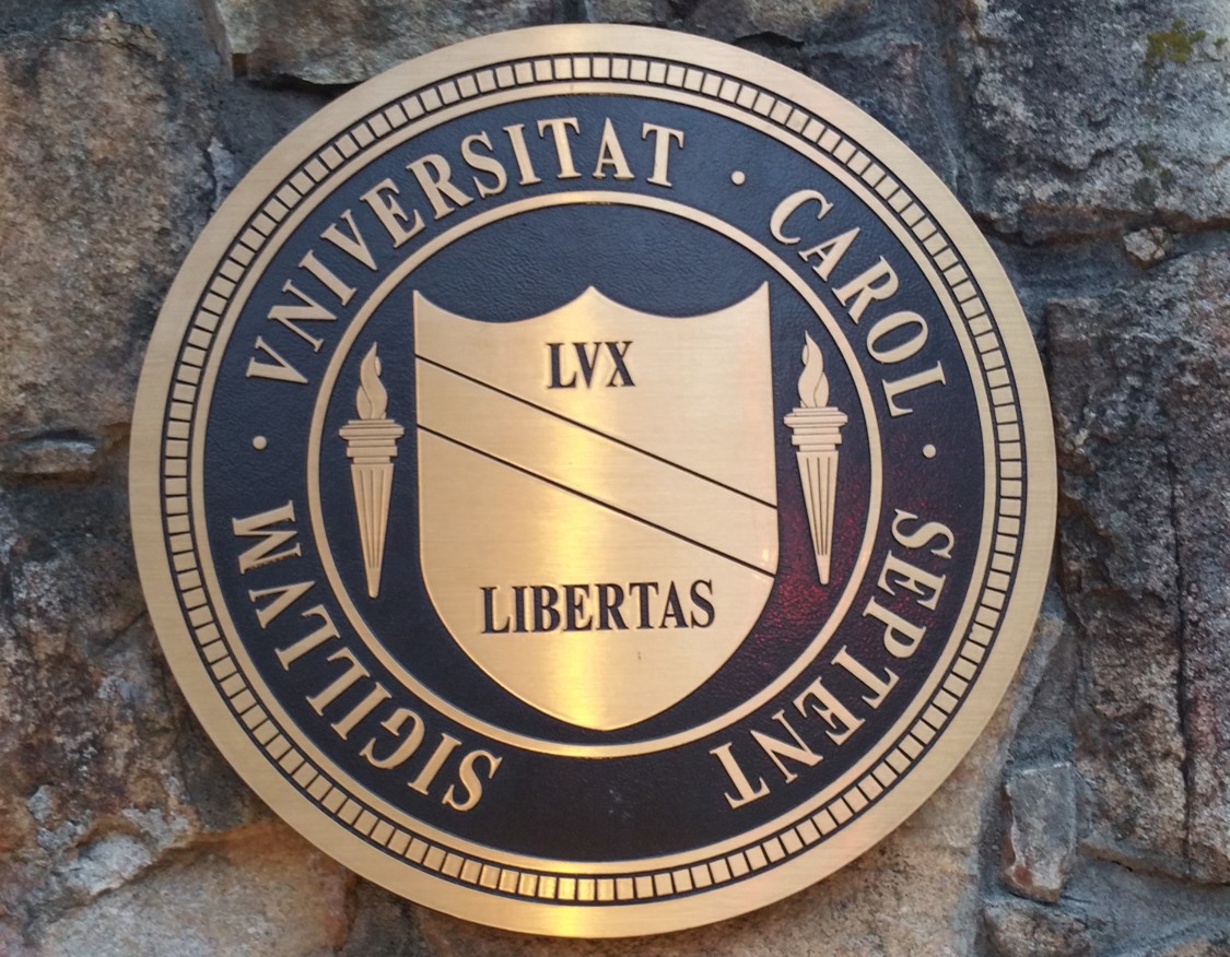 UNC seal on brick pillar near campus